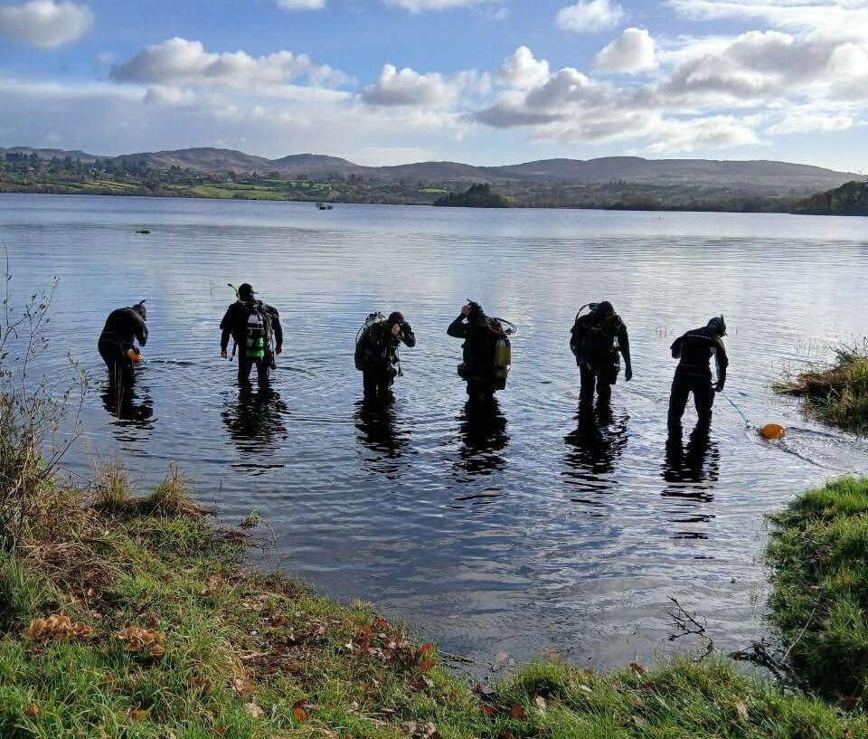 Divers hold a line in a lake search in Donegal