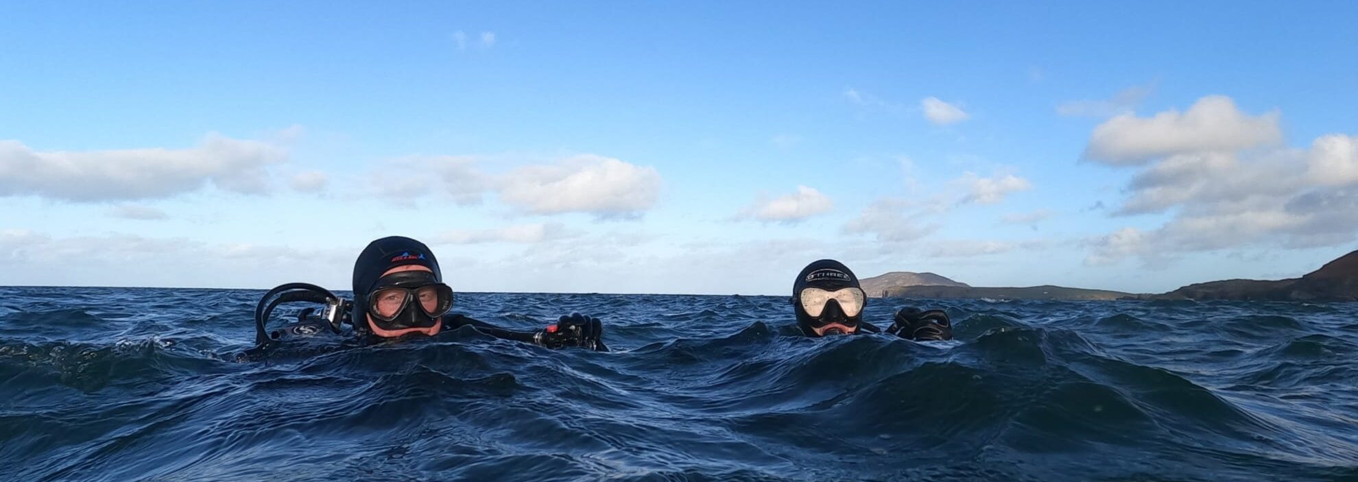 Two Scuba divers on the surface of Lough Swilly